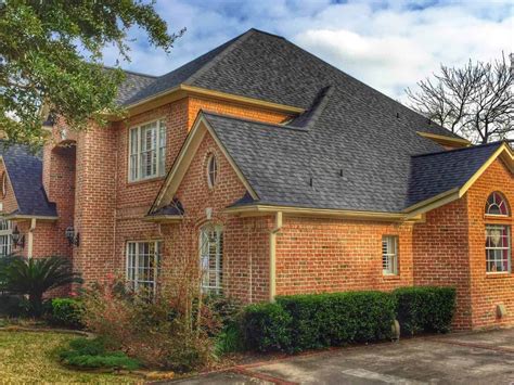 brick house with metal roof pics|black shingles on brick house.